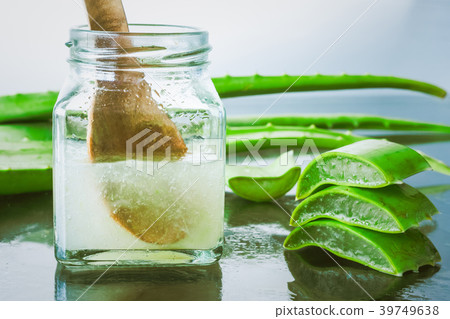 Fresh aloe vera and jelly in glass bottle Fresh aloe vera and jelly in glass bottle 39749638