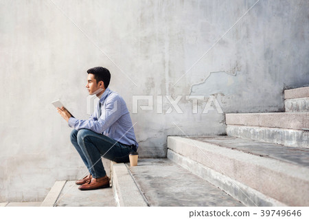 Young Businessman Siting on Stair Young Businessman Siting on Stair 39749646