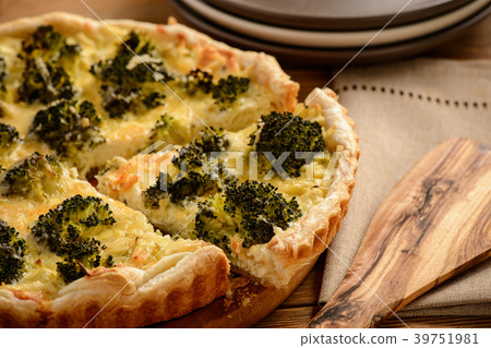 Quiche with broccoli , on wooden background. Quiche with broccoli , on wooden background. 39751981