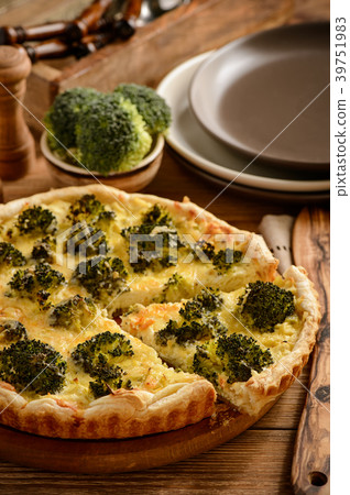 Quiche with broccoli , on wooden background. Quiche with broccoli , on wooden background. 39751983