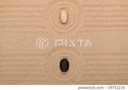 Two stone lies in the center of a circle of sand Two stone lies in the center of a circle of sand 39752216