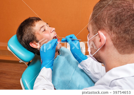 Examination by dentist Examination by dentist 39754653