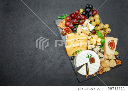 various types of cheese on stone serving board 39755311