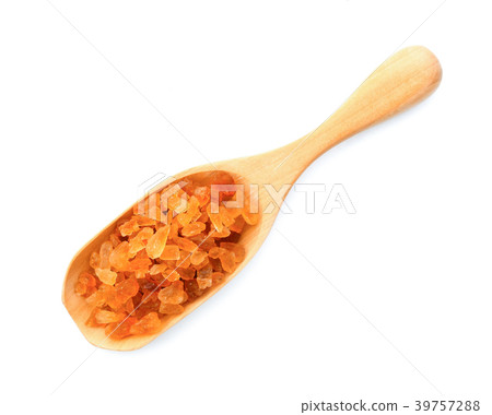 Rock sugar in wood scoop on white background Rock sugar in wood scoop on white background 39757288