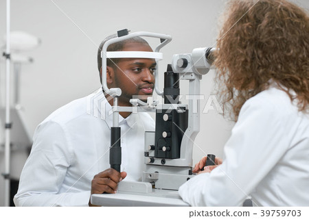 Sideview of patient looking at apparatus during 39759703