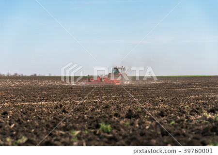 Tractor plowing fields. Tractor plowing fields. 39760001