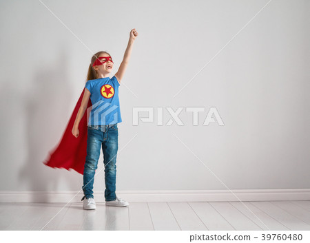 child is playing superhero 39760480