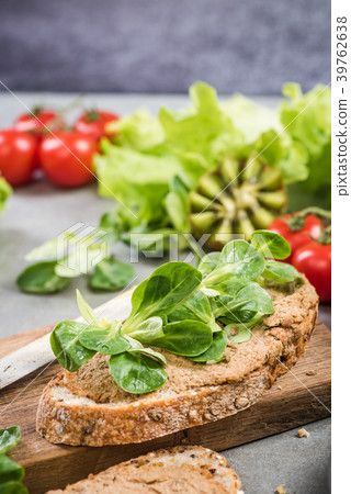 Slice of bread with hummus and salad Slice of bread with hummus and salad 39762638