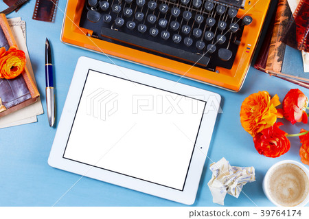 Workspace with vintage orange typewriter Workspace with vintage orange typewriter 39764174
