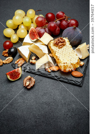Camembert cheese with honey, figs, walnuts on Camembert cheese with honey, figs, walnuts on 39764857