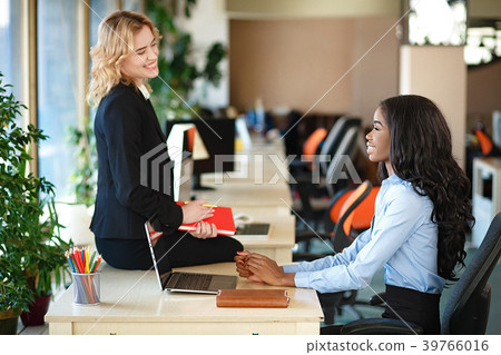 Women working together, office interior 39766016
