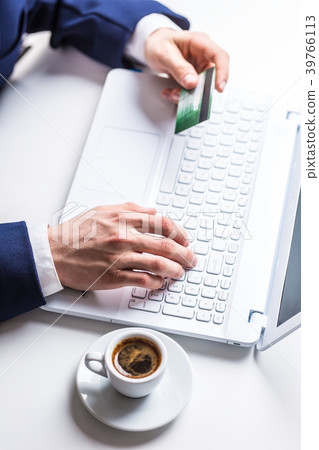 Man hands typing on the keyboard of laptop. Man hands typing on the keyboard of laptop. 39766113