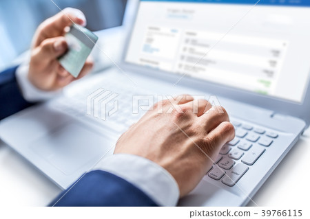Man hands typing on the keyboard of laptop. 39766115