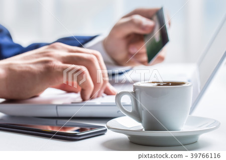 Man hands typing on the keyboard of laptop. Man hands typing on the keyboard of laptop. 39766116