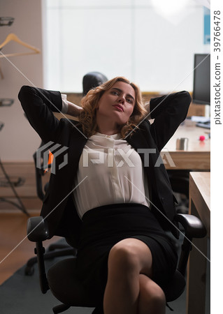 Young beautiful businesswoman is relaxing at Young beautiful businesswoman is relaxing at 39766478