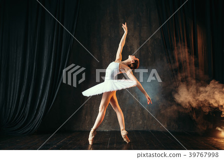 Ballerina in white dress dancing in ballet class 39767998