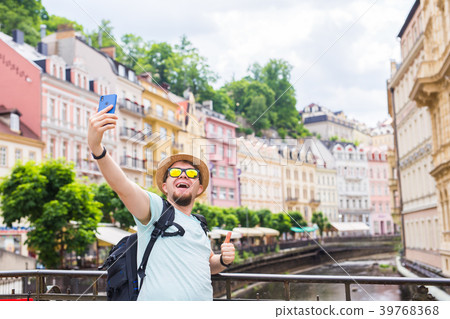 Handsome man taking selfie with mobile smart phone 39768368