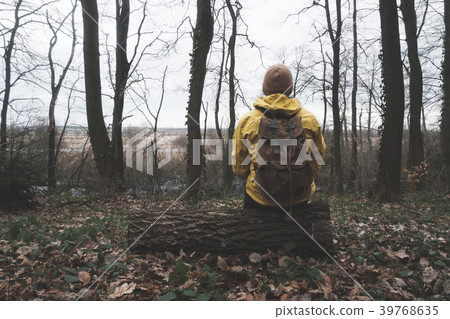 Man with backpack in wild forest 39768635