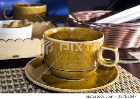 cup with green tea close-up on blurred background 39768647
