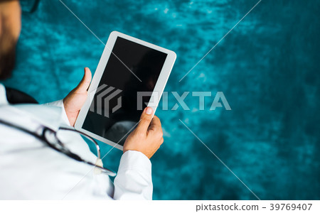 Doctor using an electronic tablet close up Doctor using an electronic tablet close up 39769407