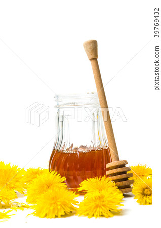 Dandelion flowers and honey jar isolated on white Dandelion flowers and honey jar isolated on white 39769432