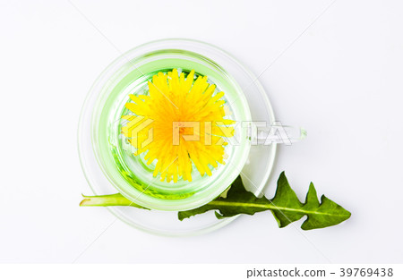 Dandelion tea and fresh flowers on a table Dandelion tea and fresh flowers on a table 39769438