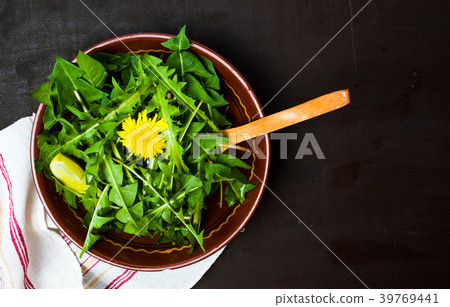 Dandelion salad in a bowl top view Dandelion salad in a bowl top view 39769441