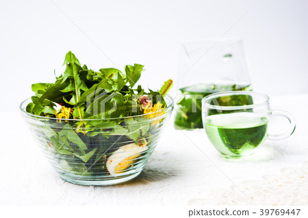 Dandelion salad in a bowl and tea Dandelion salad in a bowl and tea 39769447