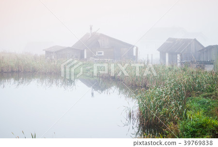 Foggy morning on a lake coast, Russia Foggy morning on a lake coast, Russia 39769838