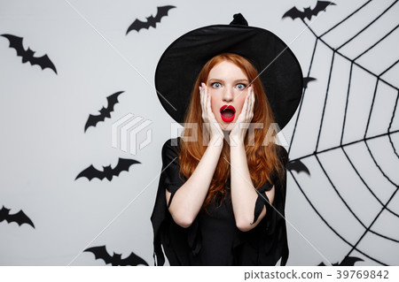 Halloween Concept - Beautiful caucasian witch Halloween Concept - Beautiful caucasian witch 39769842