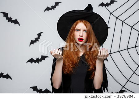Halloween Concept - Beautiful caucasian witch Halloween Concept - Beautiful caucasian witch 39769843