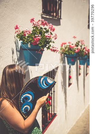 Young spanish woman with fan. Young spanish woman with fan. 39770296