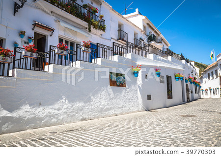 Picturesque street of Mijas with flower Picturesque street of Mijas with flower 39770303