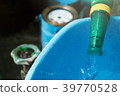 Bucket with water overflowing. And water meter 39770528