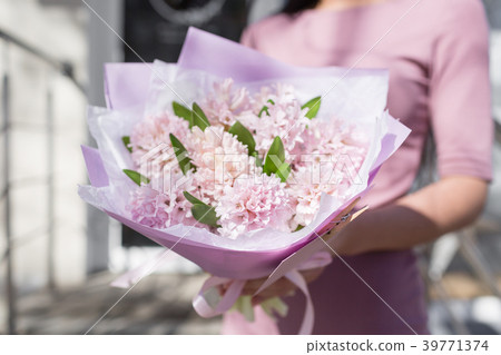 bouquet of beautiful flowers in women's hands bouquet of beautiful flowers in women's hands 39771374