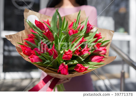 bouquet of beautiful flowers in women's hands bouquet of beautiful flowers in women's hands 39771378