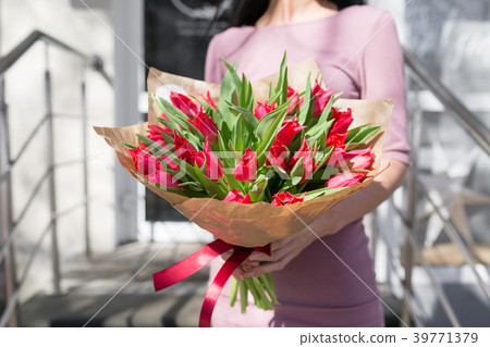 bouquet of beautiful flowers in women's hands bouquet of beautiful flowers in women's hands 39771379