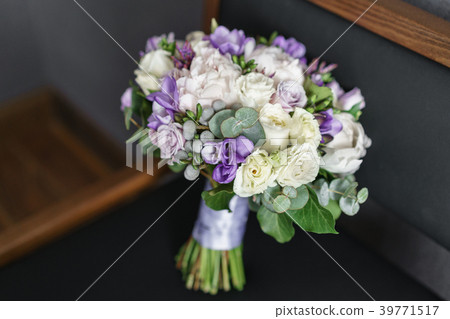 Brides wedding bouquet with peonies, freesia and Brides wedding bouquet with peonies, freesia and 39771517