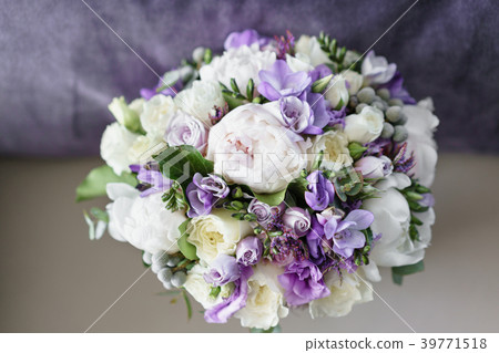 Brides wedding bouquet with peonies, freesia and Brides wedding bouquet with peonies, freesia and 39771518