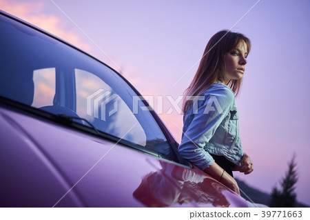 Beautiful girl fashionably stand near car 39771663