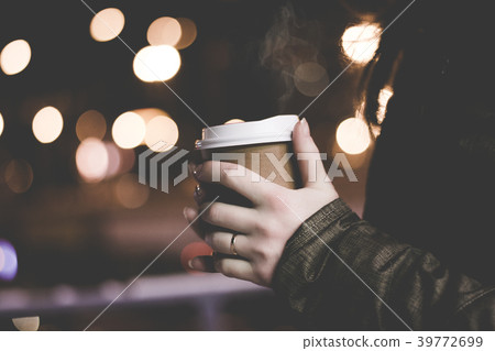 With coffee in the night city. With coffee in the night city. 39772699
