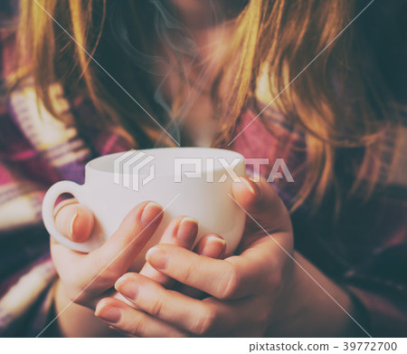 Girl with the coffee cup and plaid. 39772700