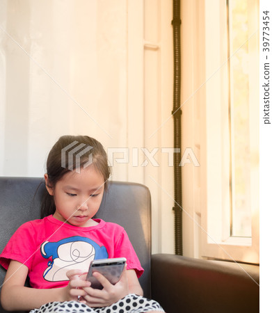 asian baby child playing the smart phone asian baby child playing the smart phone 39773454