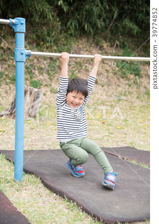 A boy who plays an iron bar A boy who plays an iron bar 39774852