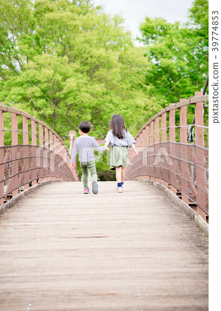 A child walking hand in hand 39774853