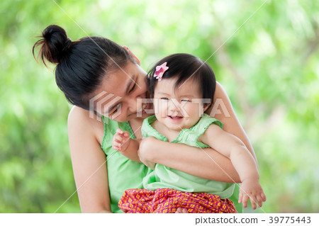 Cute asian baby girl smile and playing with mother 39775443