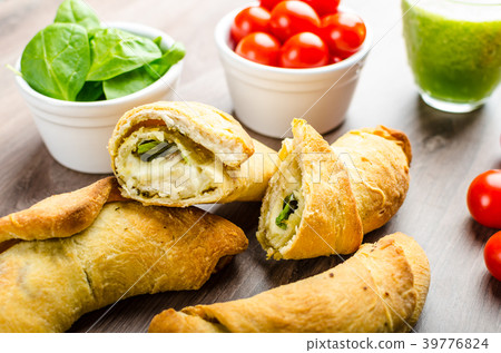 Mini Calzone roll with herbs and cheese Mini Calzone roll with herbs and cheese 39776824