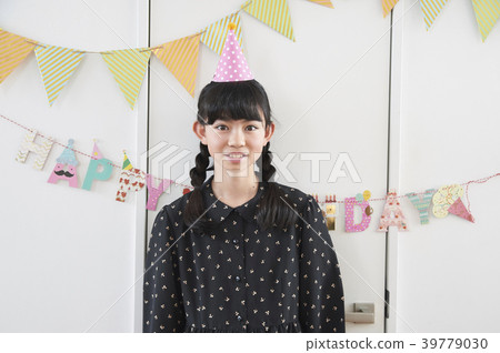 Girl enjoying a birthday party 39779030