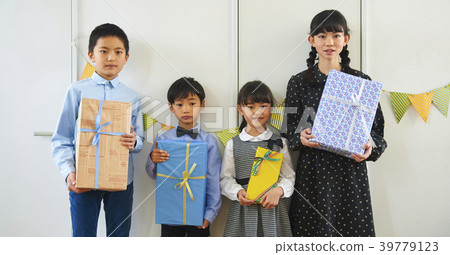 Children enjoying a birthday party Children enjoying a birthday party 39779123