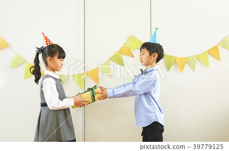 Child giving a party present 39779125